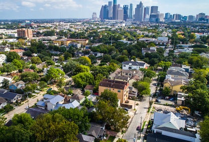 West of downtown suburb near Montrose with the downtown skyline of Houston , Texas in the distance